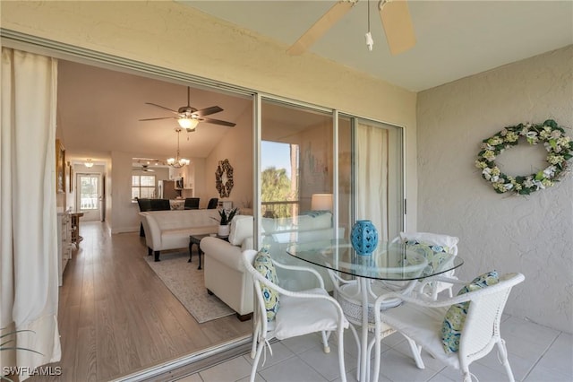 dining room featuring ceiling fan and vaulted ceiling