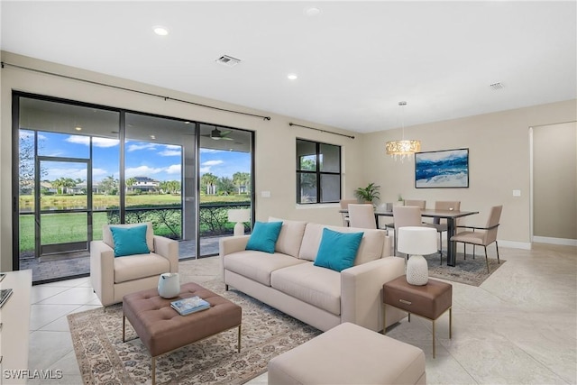 living area featuring light tile patterned floors, recessed lighting, visible vents, and baseboards