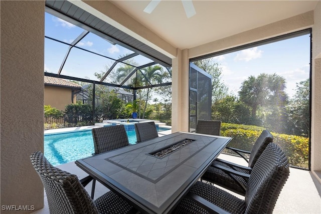 sunroom featuring a wealth of natural light and ceiling fan