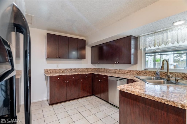 kitchen with dishwasher, sink, a textured ceiling, fridge, and dark brown cabinets