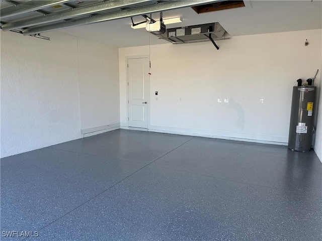 garage featuring electric water heater and a garage door opener