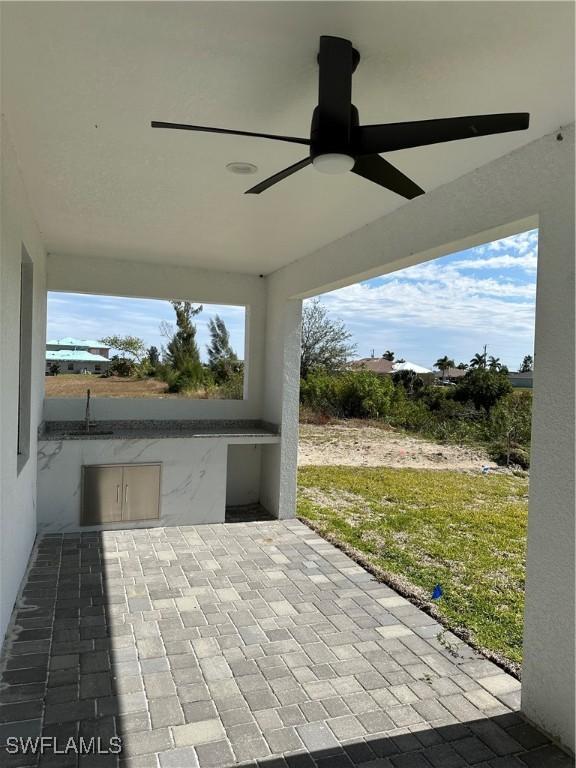 view of patio with ceiling fan