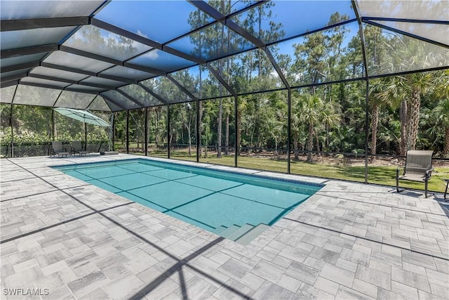 view of pool featuring a patio and a lanai