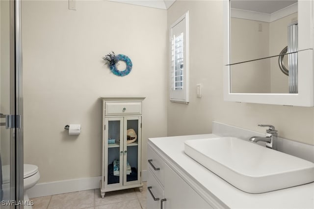 bathroom with tile patterned flooring, vanity, and toilet