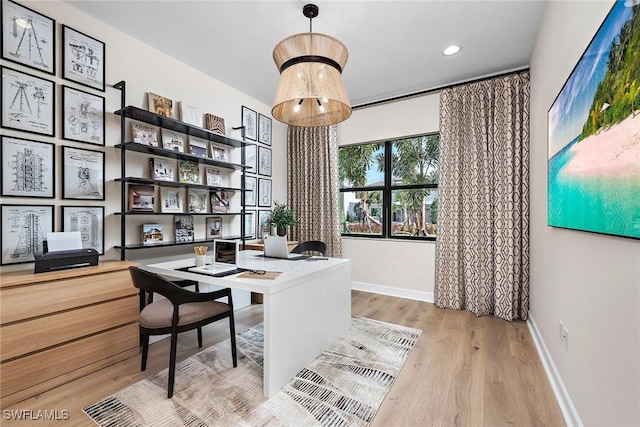 office with light wood-type flooring