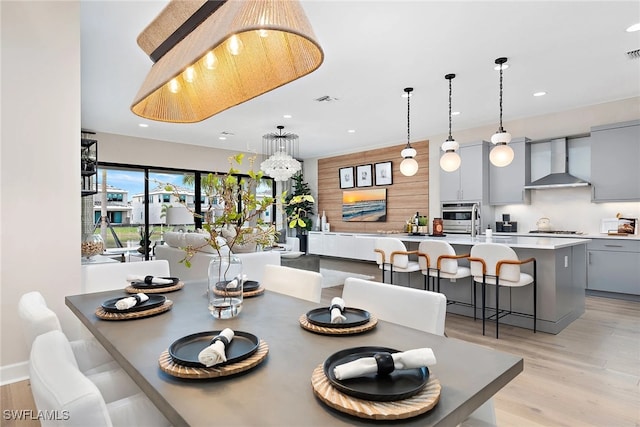 dining space with light wood-type flooring