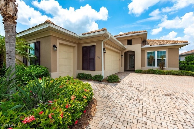 mediterranean / spanish-style house featuring a garage