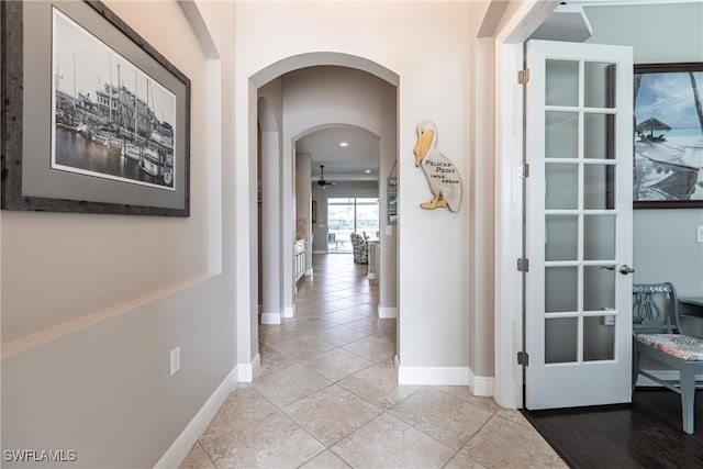 corridor with light tile patterned flooring