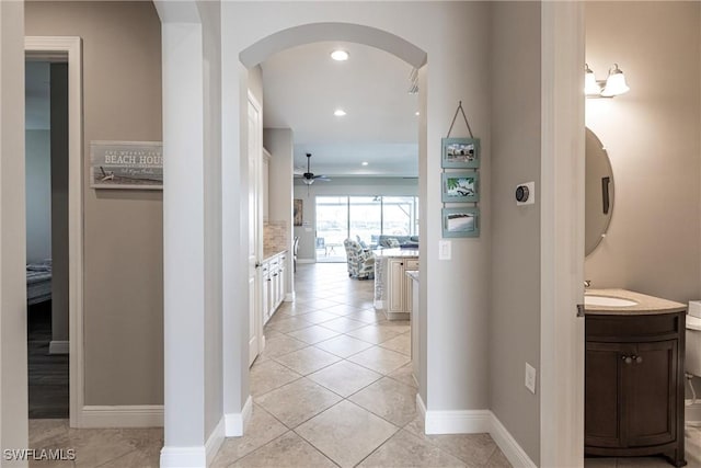 corridor featuring light tile patterned floors