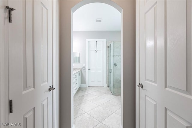 hallway with light tile patterned floors