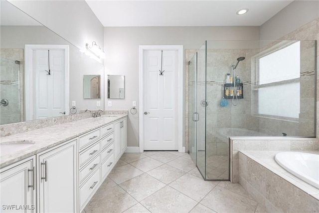 bathroom with vanity, tile patterned floors, and independent shower and bath