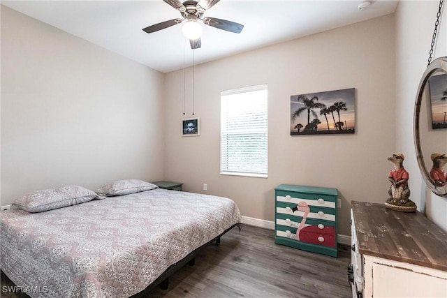 bedroom featuring ceiling fan and dark hardwood / wood-style floors