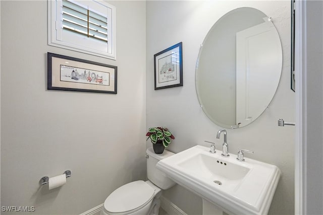 bathroom with toilet and sink