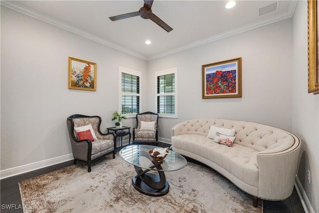 living room featuring ceiling fan, wood-type flooring, and crown molding