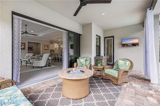 view of patio / terrace with ceiling fan and an outdoor hangout area