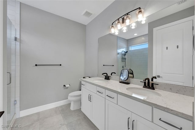 bathroom with a sink, visible vents, baseboards, and a shower stall