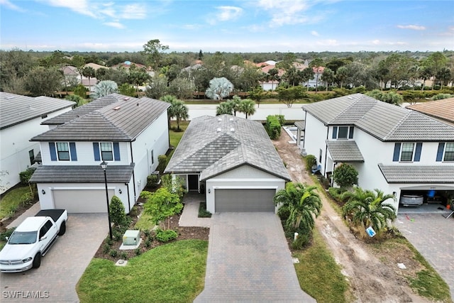 birds eye view of property with a residential view