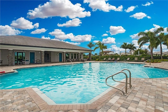 community pool with a patio area