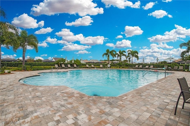 community pool with a patio area