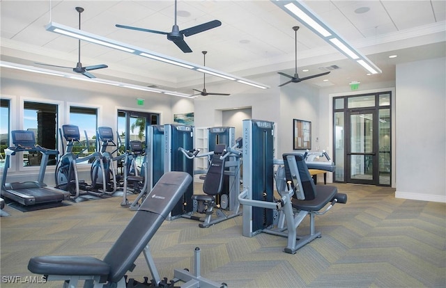 workout area with crown molding, a ceiling fan, visible vents, and carpet floors