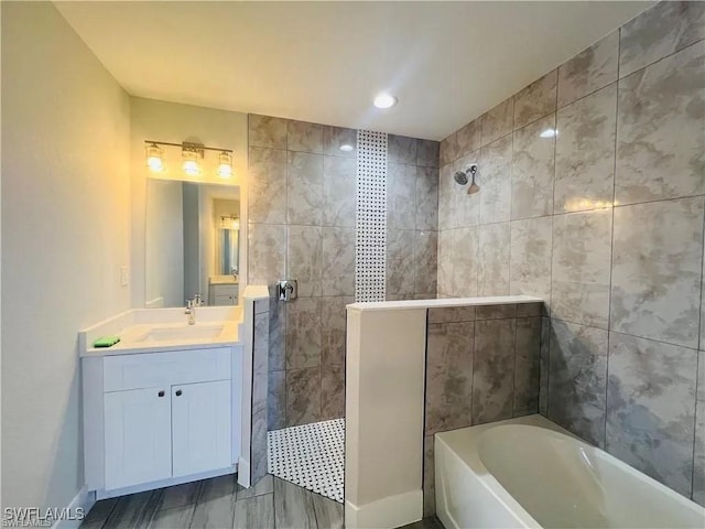 bathroom with vanity and tile walls