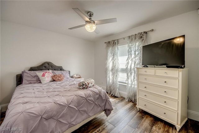 bedroom with ceiling fan and hardwood / wood-style flooring