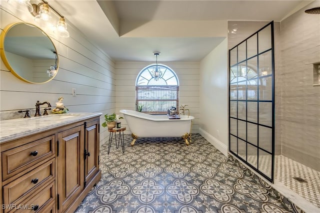 bathroom with wood walls, vanity, a notable chandelier, and shower with separate bathtub