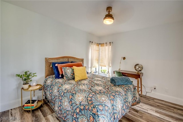 bedroom featuring ceiling fan and hardwood / wood-style floors