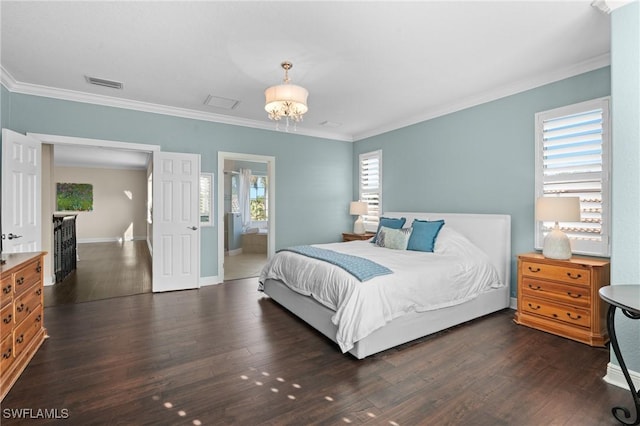 bedroom with crown molding, dark hardwood / wood-style floors, and a chandelier