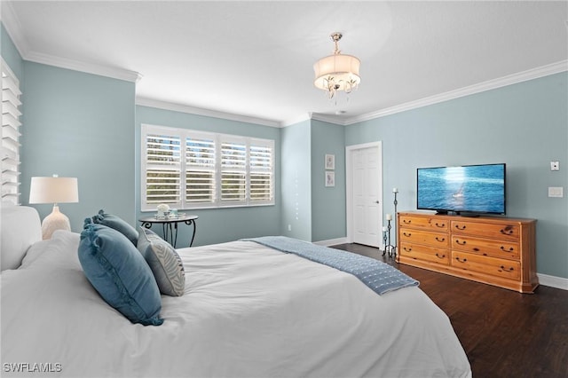 bedroom featuring crown molding, dark hardwood / wood-style floors, and an inviting chandelier