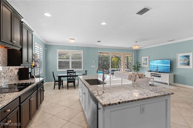 kitchen with an island with sink, sink, stainless steel dishwasher, and black electric cooktop