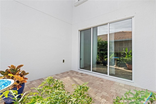 property entrance featuring a patio