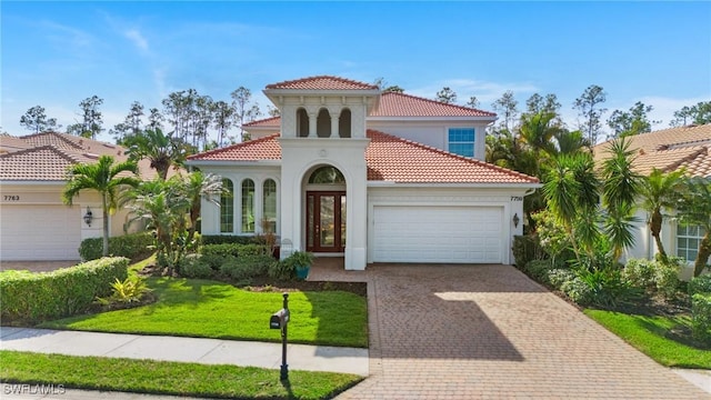 7759 Martino Cir, Naples, FL 34112 - mediterranean / spanish home with a tiled roof, stucco siding, an attached garage, and decorative driveway