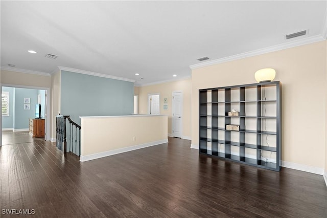 unfurnished room with crown molding and dark wood-type flooring