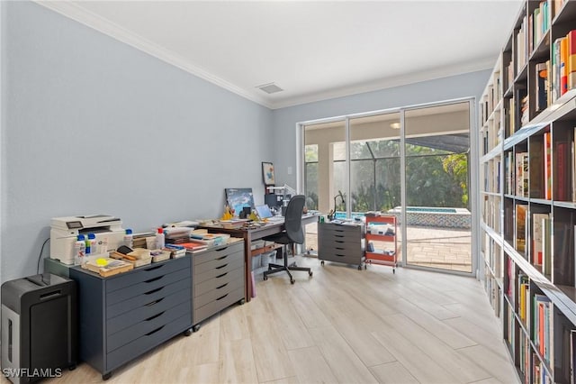 office area with crown molding and light wood-type flooring