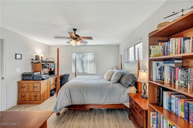 bedroom featuring ceiling fan and light hardwood / wood-style floors