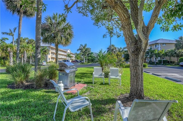 view of home's community featuring a lawn