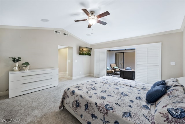 bedroom featuring ceiling fan, ornamental molding, light carpet, and vaulted ceiling