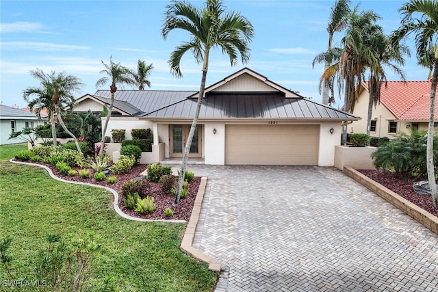 view of front facade featuring a front lawn and a garage