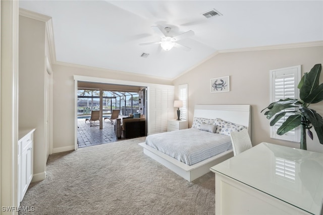 carpeted bedroom featuring ceiling fan, lofted ceiling, and ornamental molding