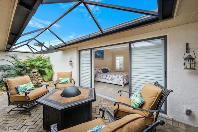 view of patio featuring a lanai