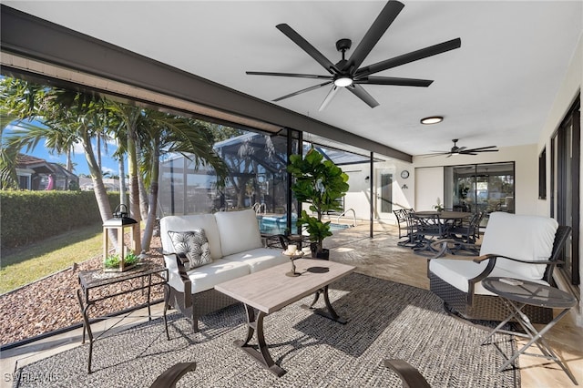 view of patio featuring ceiling fan, an outdoor hangout area, and a lanai