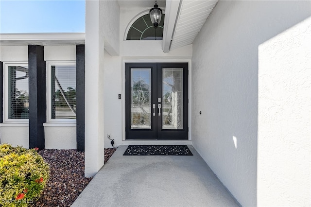 property entrance featuring french doors