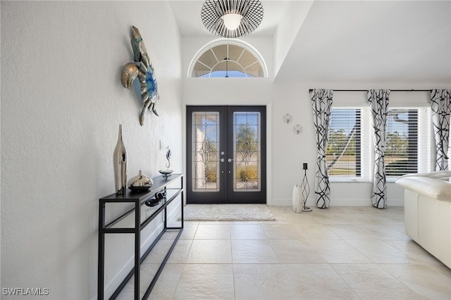 tiled foyer entrance with french doors