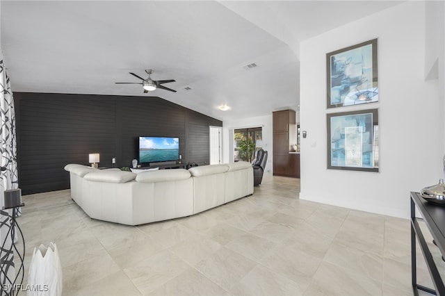 living room with lofted ceiling and ceiling fan