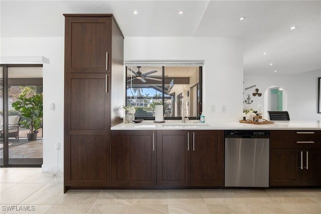 kitchen with sink, ceiling fan, dark brown cabinets, light tile patterned flooring, and stainless steel dishwasher