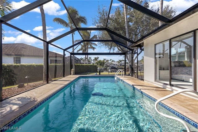 view of pool featuring a lanai and a patio area