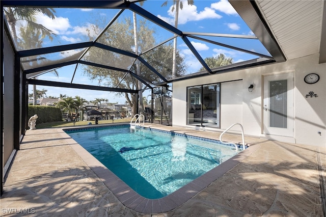 view of pool featuring a lanai and a patio area