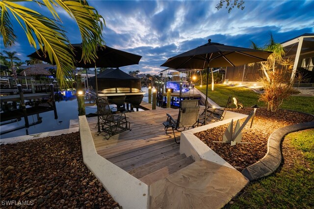 exterior space with a boat dock and a water view