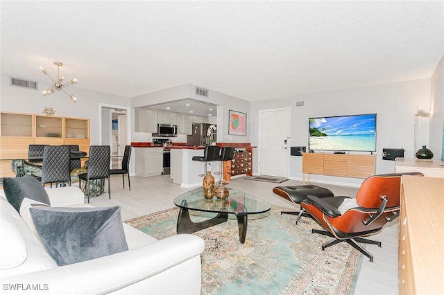 living room featuring an inviting chandelier